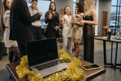 A laptop with Christmas decoration in the office