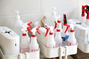 Cleaning products in white spray bottles