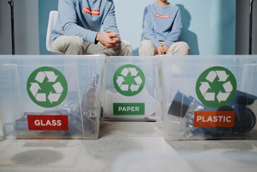 employees volunteering to recycle waste