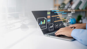 Work Order Management Software Concepts floating above a computer.